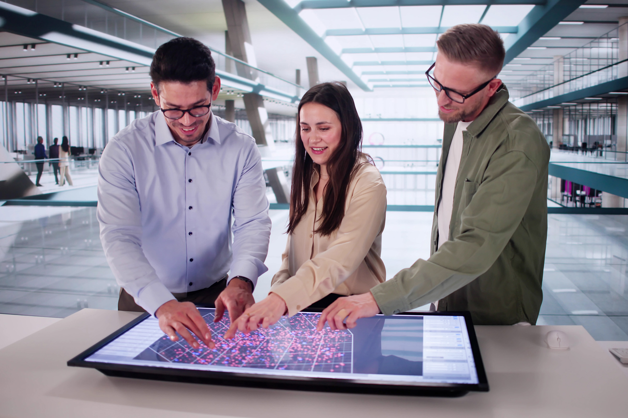 Spatial Planning - Industries: Three people discuss using a digital map with data.